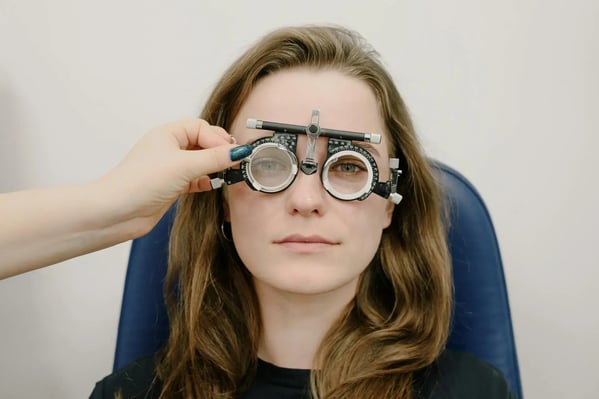 Doctor using medical device to check for sight problems